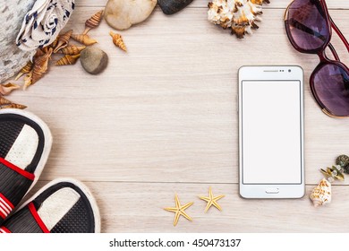 Smartphone Gadget With White Screen Blank For Design With Star, Shells, Flip Flops, Sunglasses, Stones, Panama Hat On Wood Background. Top View Flat Lay Mock Up For Tourism, Travel Beach Holiday Image