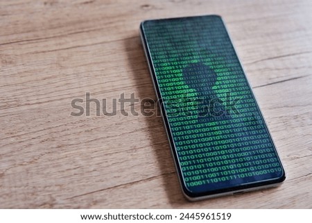 Smartphone with glowing binary code and keyhole on the screen. Copy space for text. Cyber security concept.