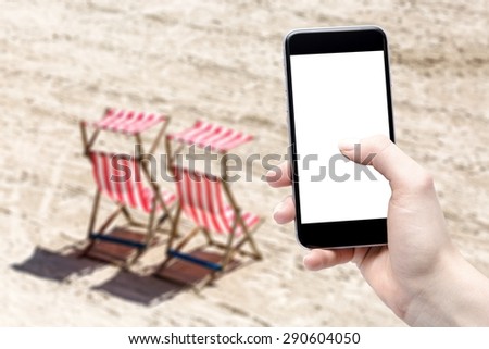 smartphone in hand and beach