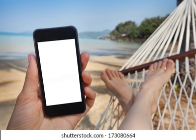 smartphone in the hand in beach hammock - Powered by Shutterstock