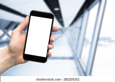 smartphone in hand and blurred background