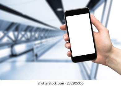 smartphone in hand and blurred background