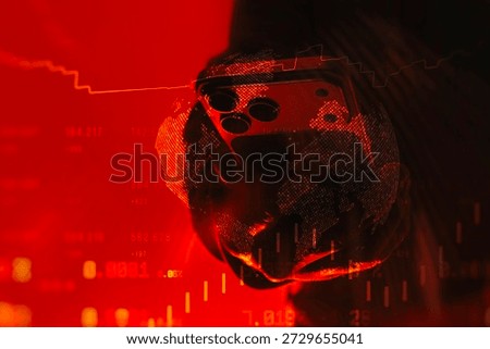 Smartphone held in hand with global data visualization and financial charts on a red background. Concept of digital risk, cybersecurity threat, global finance instability and technology warning