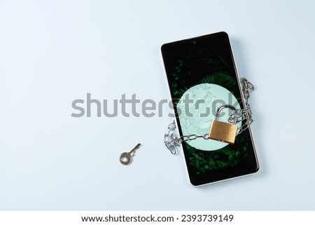 smartphone and keys on bluebackground