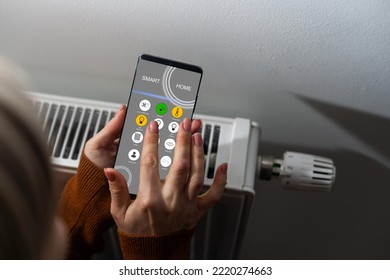 Smartphone With Launched Application For Air Temperature Adjustment Opposite The Radiator. Health Microclimate At Home Concept