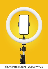 smartphone with led ring lamp isolated on yellow background - Shutterstock ID 2080974925