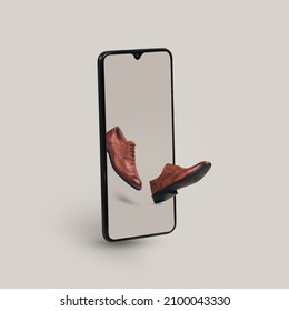 Smartphone With Men's Fashion Leather Shoes On A Gray Background.  Creative Minimal Concept Of Online Shopping, Men’s  Fashion And Trend.  E - Commerce Store And Shop On Smartphone.