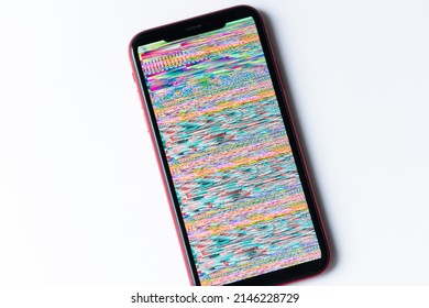 smartphone, mobile phone closeup. Glitches, distorted, corrupted image with colorful lines on the phone. Color channels effect.
