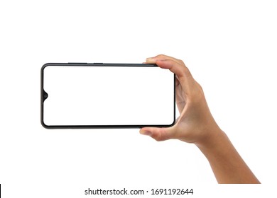 Smartphone Mock Up, Asian Girl Hand Holding Mobile Phone And Using Touching Screen Isolated On White Background, Selective Focus And Copy Space.