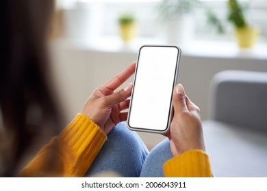 Smartphone Mockup. Closeup Of Woman Using Mobile Phone With Empty Screen At Home