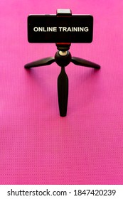 Smartphone Mounted On Tripod, Yoga Mat In The Background