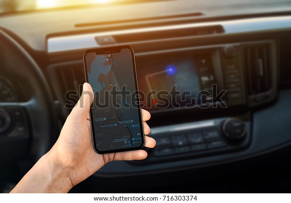 smartphone\
navigation map app in car, point of\
view