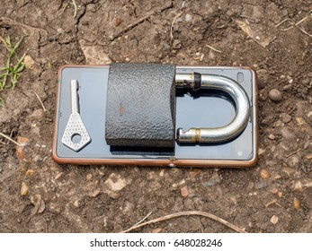 Smartphone, old key, lock - security idea, concept