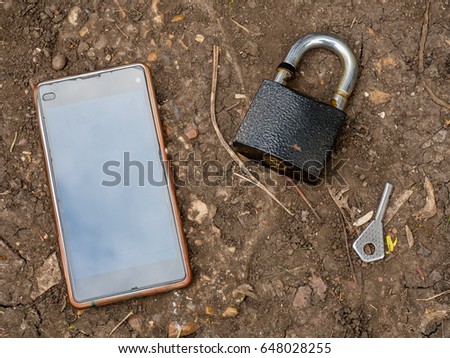 Smartphone, old key, lock - security idea, concept