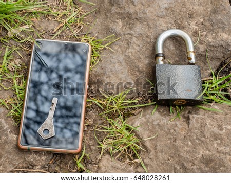 Smartphone, old key, lock - security idea, concept