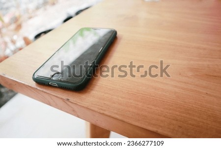 a smartphone on a wooden table