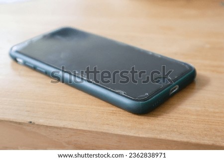 a smartphone over a wooden background