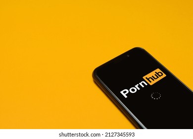 Smartphone with a Pornhub logo. Pornhub is a pornographic video sharing and pornography website. Moscow, Russia - February 21, 2022.