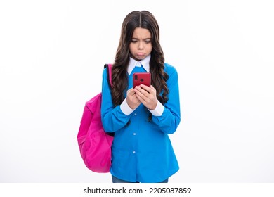 Smartphone And School Child. Student Girl With Phone On Isolated Background. Angry Teenager Girl, Upset And Unhappy Negative Emotion.