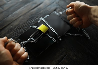 Smartphone Security: Hands Breaking Chains, Padlock Concept of Digital Freedom and Protection