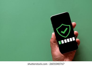 Smartphone security with a shield icon and password protection on screen. Perfect for cybersecurity, data protection, mobile security, and privacy protection.