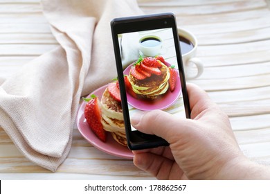 smartphone shot food photo  - pancakes for breakfast with fresh strawberries - Powered by Shutterstock