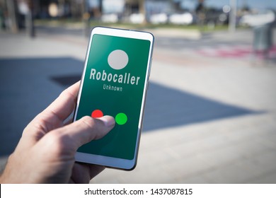 Smartphone Showing On Screen An Illegal Robocall. Smartphone Showing A Call From A Robocaller On Screen