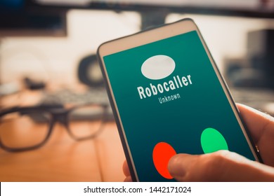 Smartphone Showing On Screen An Illegal Robocall. Smartphone Showing A Call From A Robocaller On Screen