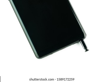 Smartphone and stylus on a white background