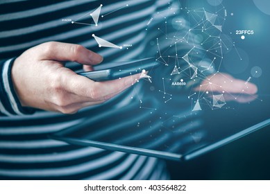 Smartphone and tablet data synchronization, woman syncing files and documents on personal wireless electronic devices at home, selective focus with shallow depth of field.