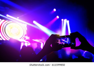 Smartphone Talking Video For Facebook Live At Blurred Disco Party And Concert Live.