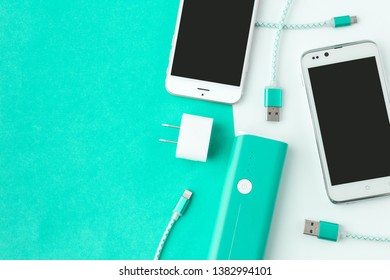 smartphone and USB cable charger with copy space - Shutterstock ID 1382994101