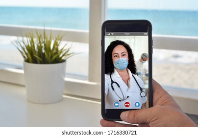 Smartphone Video Call To Talk To Doctor Woman With Mask