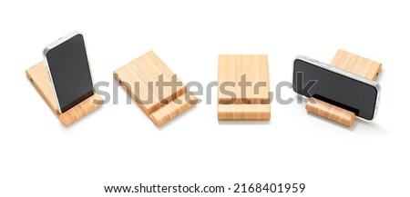 Smartphone wooden stand isolated on white background. Product design. Smartphone stand. Packshot photography. Scandinavian design. Household and Stationery. Simplicity. Wooden product design. Timber. 