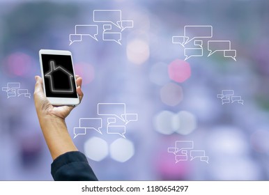 Smartphones in hand women, on screen message symbols and wifi, blurred bokeh from car lights and traffic jams, with concept of wireless connectivity and communication and convenient