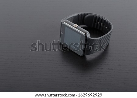 smartwatch black technological clock on a black background