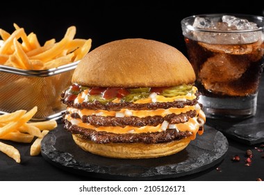 Smash burger with fries in black backgraund