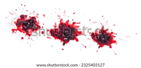 Smashed black currant berries isolated on white background