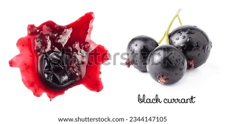 Smashed black currant berries isolated on white background