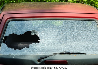 Smashed And Broken Rear Window Windscreen Or Windshield Glass Of The Car In Crash Accident