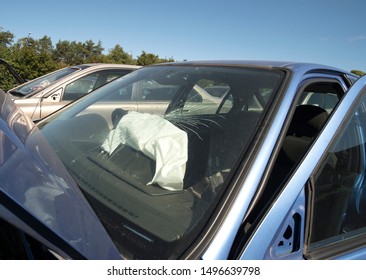 Smashed car windscreen with airbag deployed