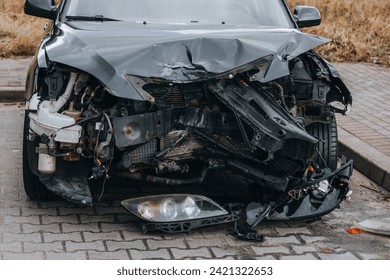 SMASHED FRONT OF PASSENGER CAR 