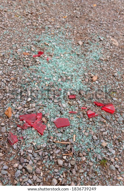 Smashed\
glass from a car window scattered on the\
ground