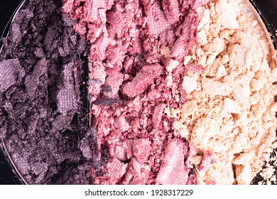 Smashed set of multicolor eyeshadow. Close-up of a makeup product.