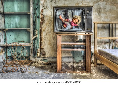 Smashed TV With Doll Inside Screen In A Dilapidated Bedroom