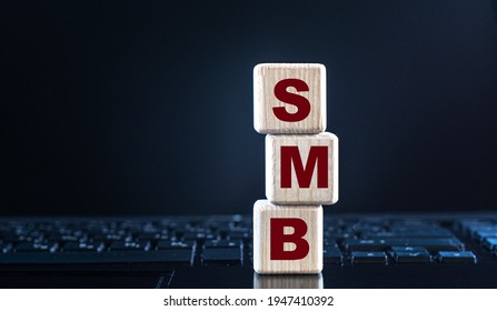 SMB (Server Message Block) - Acronym On Wooden Cubes On The Background Of The Laptop Keyboard. Internet Concept