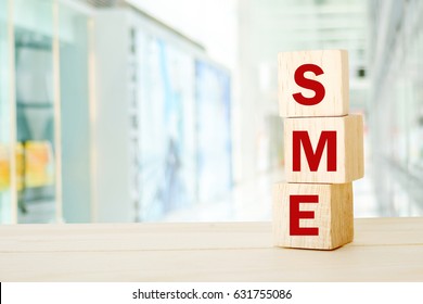 SME , Small And Medium Enterprise , Business Word On Wooden Cubes Background, With Copy Space For Text