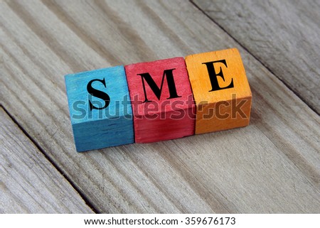 SME text (Small Medium Enterprises) on colorful wooden cubes