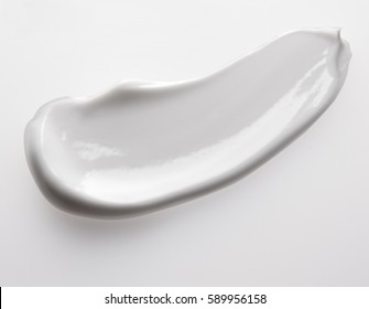 Smear Cream Isolated On White Background. Cream Texture.