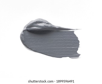 Smear of a gray magnetic or charcoal mask on a white isolated background. Smudge texture brush stroke.